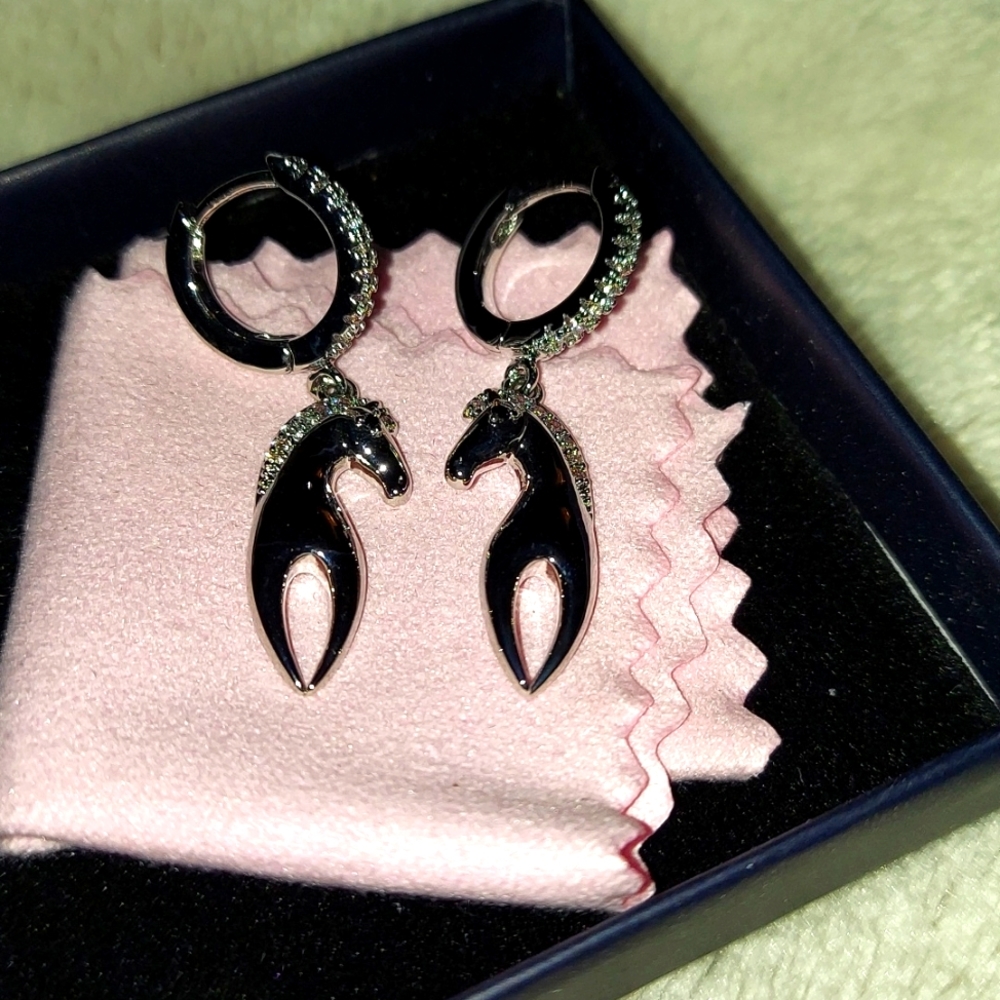 Silver horse earrings made by Iefil with rhinestones.